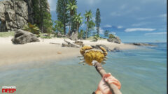 Stranded Deep player catches a giant crab with a crude spear on a tropical island beach